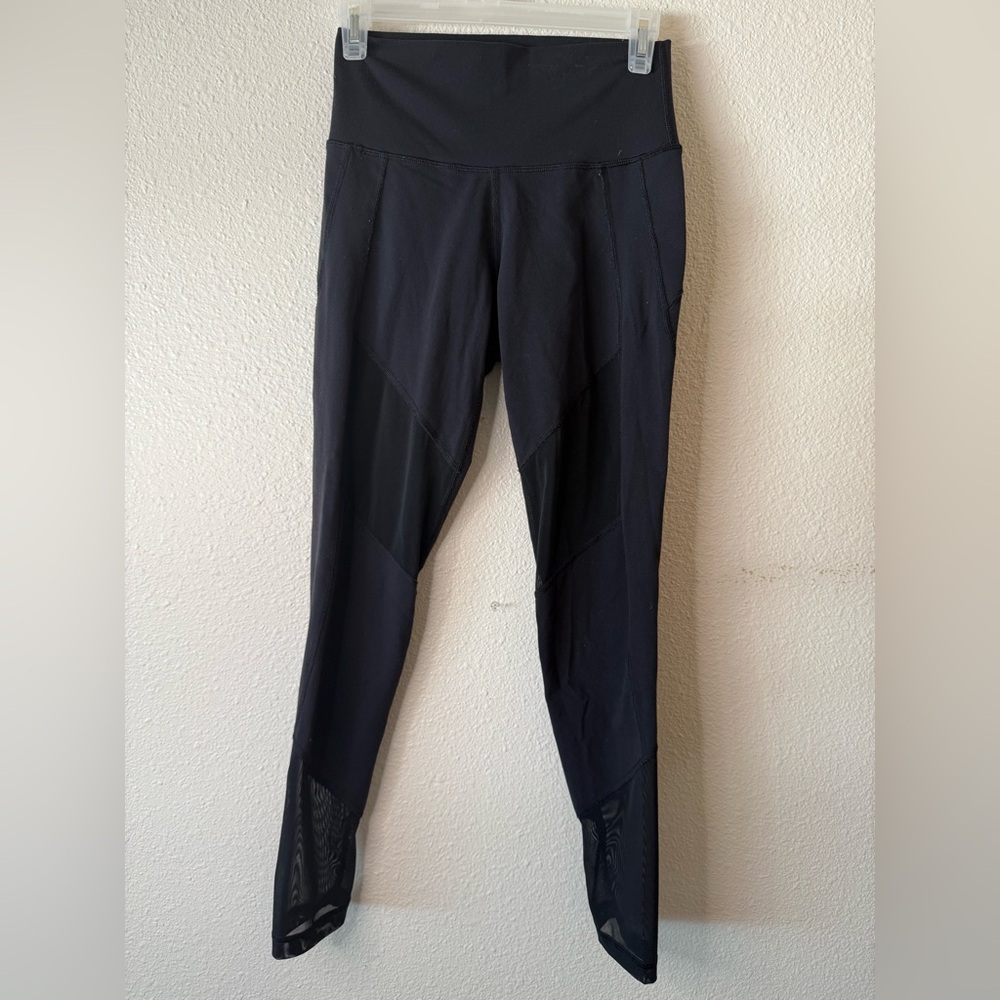 TNA Black High-Rise Leggings with Mesh Hem Panels